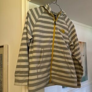 The North Face light weight fleece. Hooded. Gray/ cream strip. Yellopw zipper.